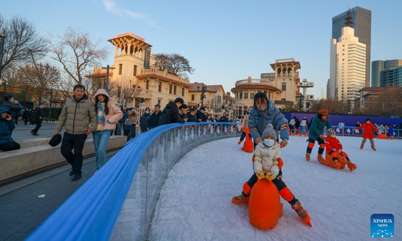 People have fun at an ice rink in a public square of the Italian Style Area in Tianjin, north China, Dec. 9, 2023. (Photo: Xinhua)