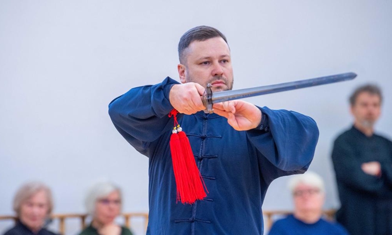 A participant performs at the Chinese Wushu (Kung Fu) and Tai Chi Performance Competition held by Lithuanian Wushu Federation in Vilnius, Lithuania, Dec. 9, 2023. (Photo: Xinhua)