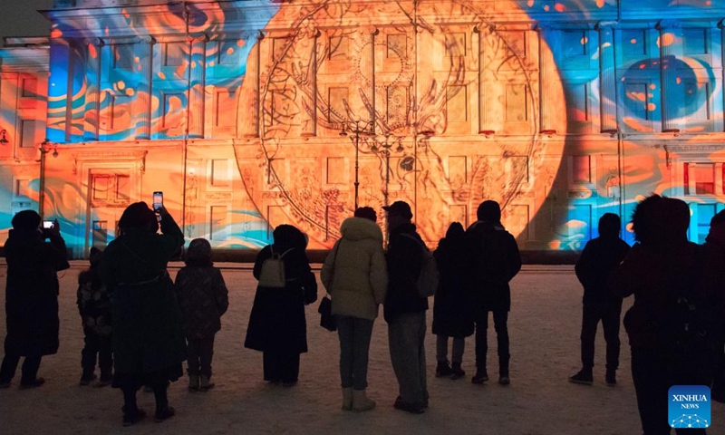 People watch a light show at the Palace Square in St. Petersburg, Russia, on Dec. 9, 2023. The light show was held Saturday to mark the 259th anniversary of the State Hermitage Museum. (Photo: Xinhua)