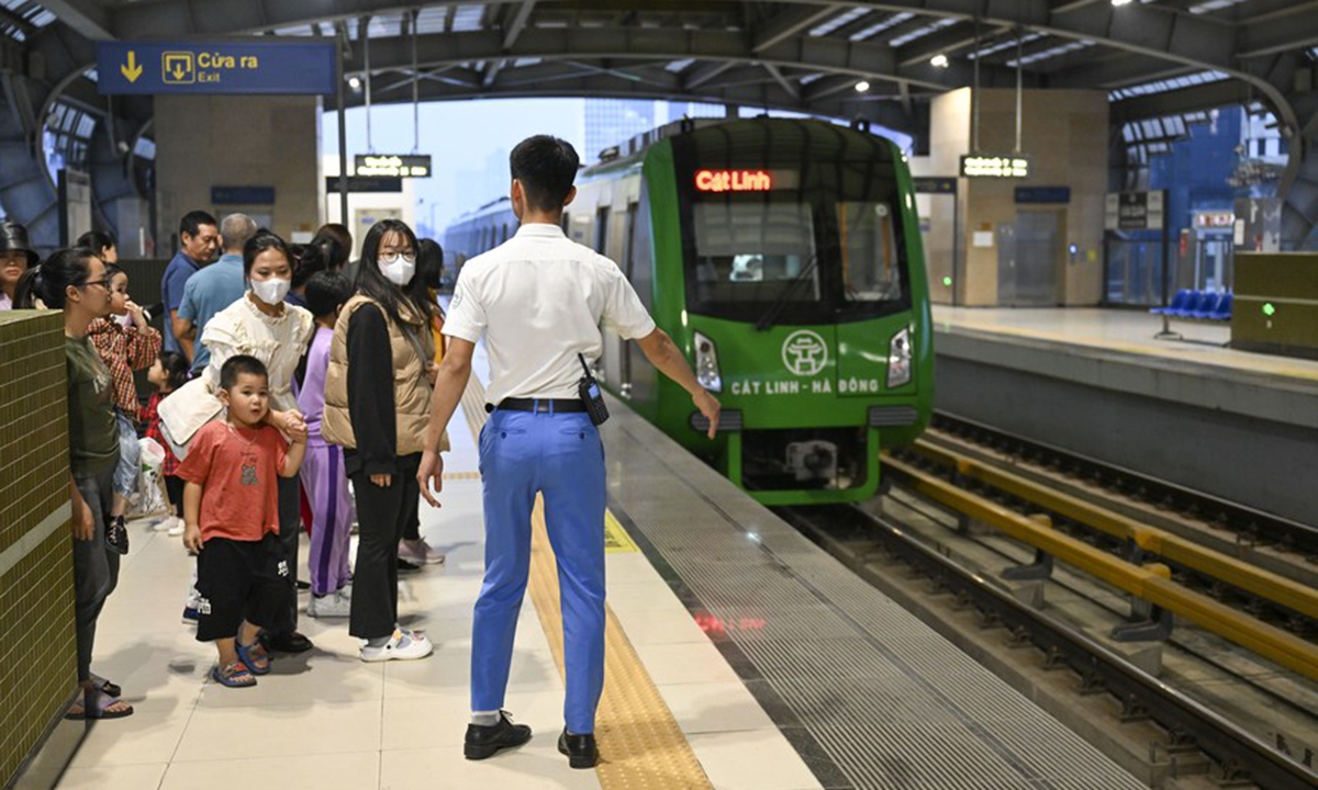 People wait for a train of the Cat Linh-Ha Dong urban elevated railway in Hanoi, Vietnam, Dec. 9, 2023. (Photo: Xinhua)