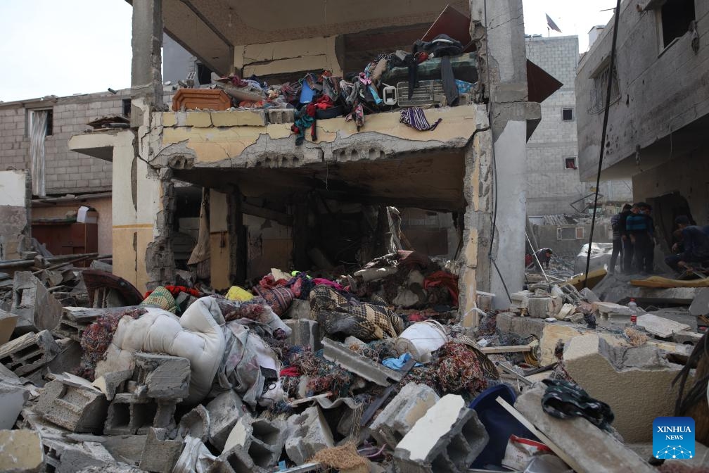 This photo taken on Dec. 10, 2023 shows damaged buildings after an Israeli airstrike in Maghazi refugee camp, central Gaza Strip.(Photo: Xinhua)