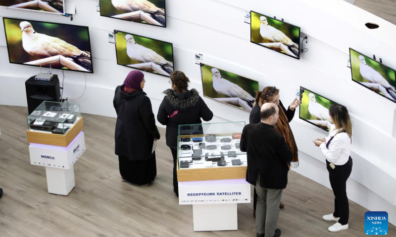 People attend the Algerian Production Fair in Algiers, Algeria, on Dec. 16, 2023. The fair is held here from Dec. 14 to Dec. 23. (Xinhua)