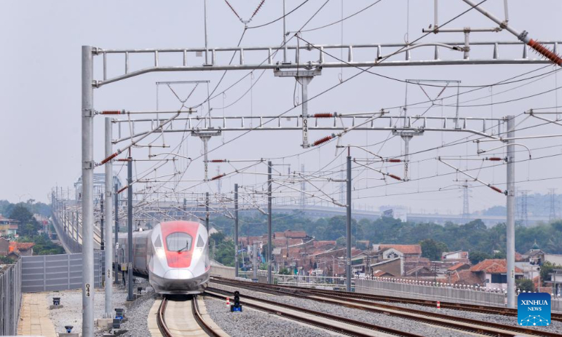 A high-speed electrical multiple unit (EMU) train is about to arrive at Padalarang Station in Padalarang, Indonesia, Dec. 12, 2023. According to PT Kereta Cepat Indonesia-China (KCIC), a joint venture consortium between Indonesian and Chinese state-owned firms that constructs and runs the Jakarta-Bandung high-speed railway (HSR), the HSR has delivered more than 700,000 passengers since it was officially put into commercial operation on Oct. 17. (Xinhua/Xu Qin)