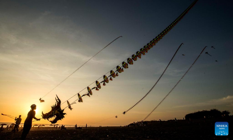 People fly dragon kites at Parangkusumo beach in Bantul district, Yogyakarta, Indonesia, on Dec. 17, 2023. (Photo by Agung Supriyanto/Xinhua)