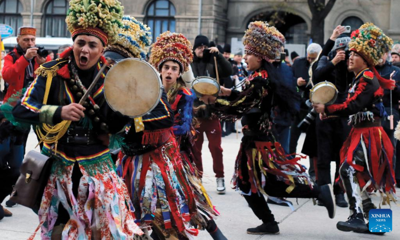 Members of a traditional song and dance band perform during the 