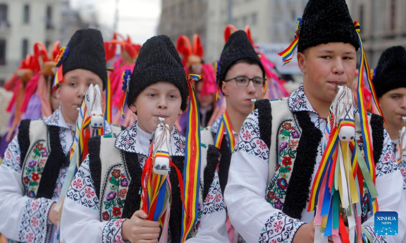 Members of a traditional song and dance band perform during the 