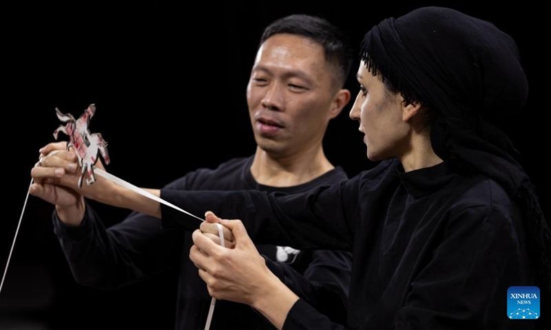 Iranian puppeteer Fahimeh Barotchi (R) gives instructions as Chen Daigong, puppeteer and inheritor of a local Chinese puppet performing art, learns to play at a puppet art preservation center in Jinjiang of Quanzhou City, southeast China's Fujian Province, Dec. 11, 2023. Puppet artists from 12 countries are invited to Quanzhou, a city widely believed to be the starting point of the ancient Maritime Silk Road, to give puppet performances and communicate with local puppet artists.(Photo: Xinhua)