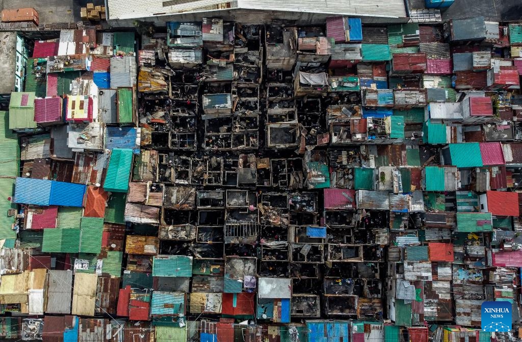 This aerial photo shows the site after a fire at a slum area in Manila, the Philippines on Dec. 12, 2023. The pre-dawn fire that erupted Tuesday left 240 families homeless, the Philippine Bureau of Fire Protection said.(Photo: Xinhua)