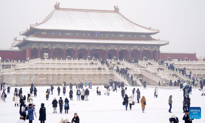 People visit the Palace Museum in snow in Beijing, capital of China, Dec. 13, 2023. (Xinhua/Chen Yehua)