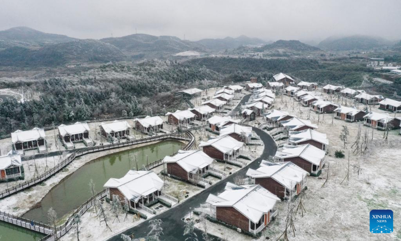 This aerial photo taken on Dec. 16, 2023 shows the snow scenery at the Chuanhegai scenic spot in Yongdong Town, Xiushan Tujia and Miao Autonomous County in Chongqing, southwest China. (Xinhua/Wang Quanchao)