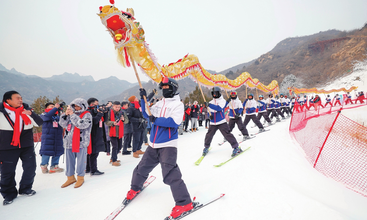 Ski instructors perform dragon dance to celebrate the impending Chinese Year of the Dragon at the Beijing Huaibei International Ski Resort on January 30, 2024. Photo: IC