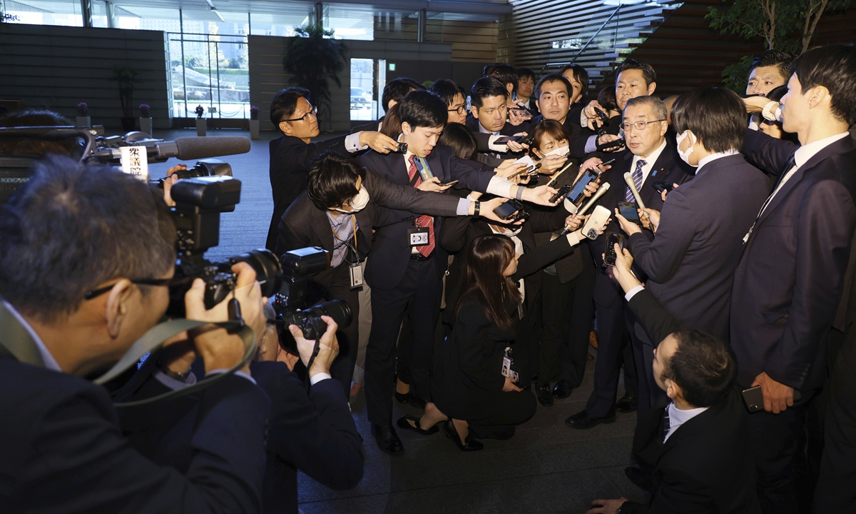 Japanese Minister of Internal Affairs and Communications Junji Suzuki answers questions from reporters after submitting his resignation at the Prime Minister's Office in Tokyo on December 14, 2023. Prime Minister Fumio Kishida and his ruling Liberal Democratic Party are in hot water over suspicions that party factions underreported funds for years. Photo: VCG