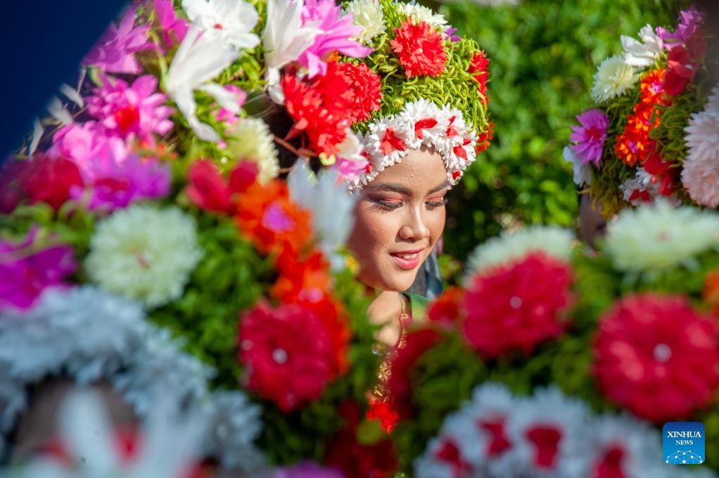 A girl decorated with flowers on her head participates in a celebration for the traditional Ngarot festival at Lelea village in Indramayu district, West Java, Indonesia, on Dec. 13, 2023. Ngarot is a traditional ceremony in Indramayu of West Java Province held to welcome the rice planting season.(Photo: Xinhua)