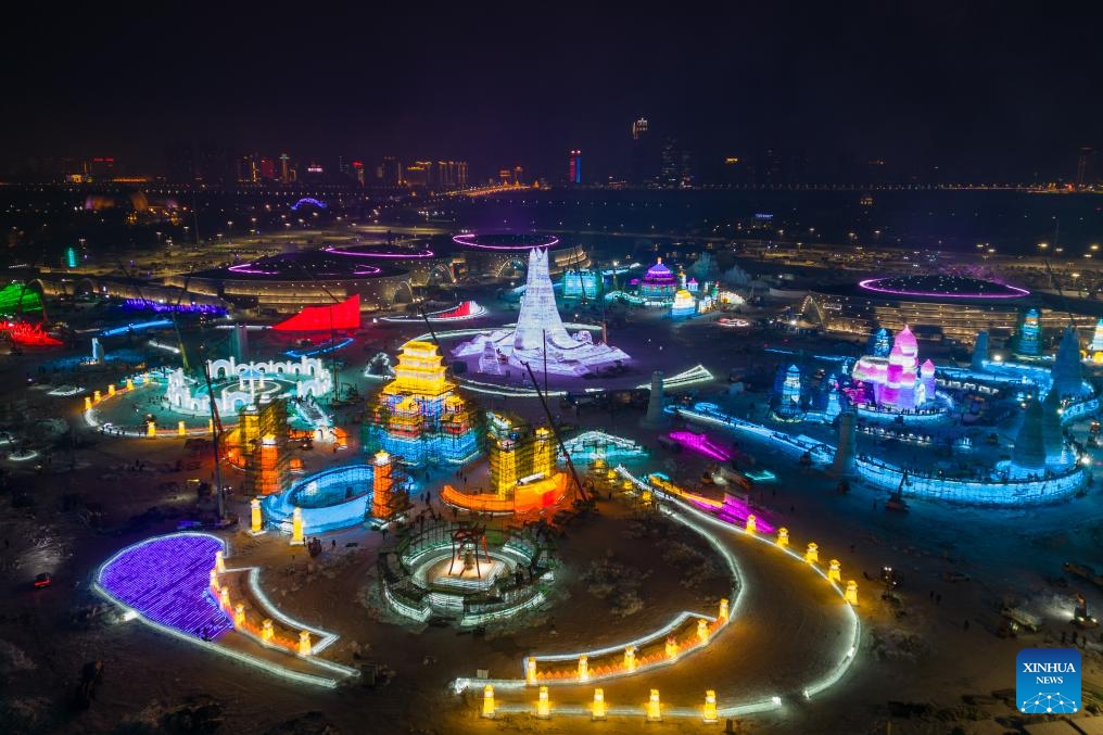 This aerial photo taken on Dec. 12, 2023 shows the construction site of the Harbin Ice and Snow World, a renowned seasonal theme park opening every winter, in Harbin, northeast China's Heilongjiang Province. Harbin Ice and snow World will open for its 25th winter season on Dec. 18. It is estimated that 250,000 cubic meters of ice and snow will be used in its construction.(Photo: Xinhua)