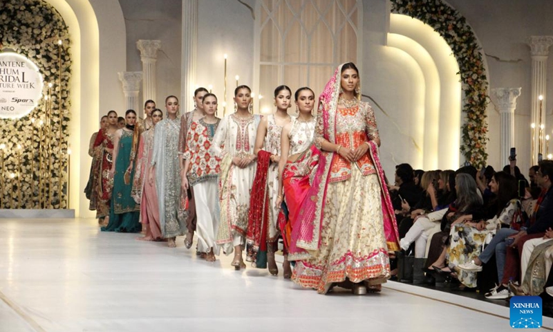 Models present creations on the last day of the Bridal Couture Week in Lahore, Pakistan, Dec. 17, 2023.(Photo: Xinhua)