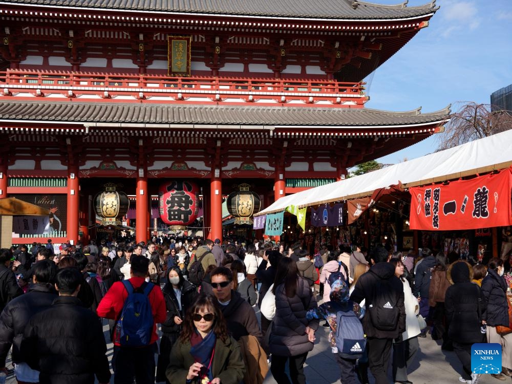 People visit a yearend fair in Asakusa, Tokyo, Japan, Dec. 19, 2023. The yearend event, also named Hagoita Fair, is held at Asakusa, Tokyo from Dec. 17 to 19. The fair has a history of more than 100 years.（Photo: Xinhua)