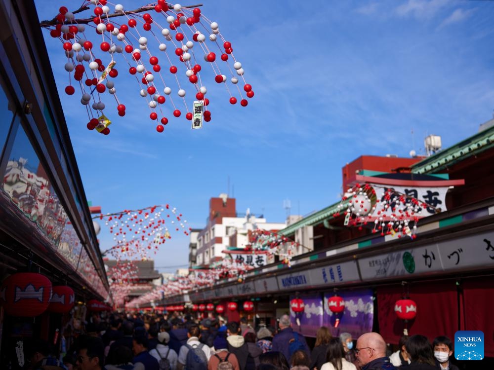 Decorations to celebrate the new year are seen on the shops of the Nakamise commercial street in Asakusa, Tokyo, Japan, Dec. 19, 2023. The yearend event, also named Hagoita Fair, is held at Asakusa, Tokyo from Dec. 17 to 19. The fair has a history of more than 100 years.（Photo: Xinhua)