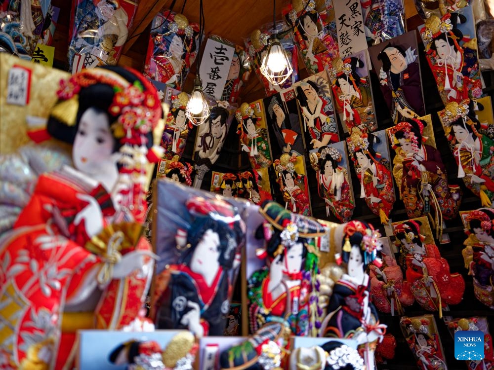 Decorations to celebrate the new year are seen on the shops of the Nakamise commercial street in Asakusa, Tokyo, Japan, Dec. 19, 2023. The yearend event, also named Hagoita Fair, is held at Asakusa, Tokyo from Dec. 17 to 19. The fair has a history of more than 100 years.（Photo: Xinhua)