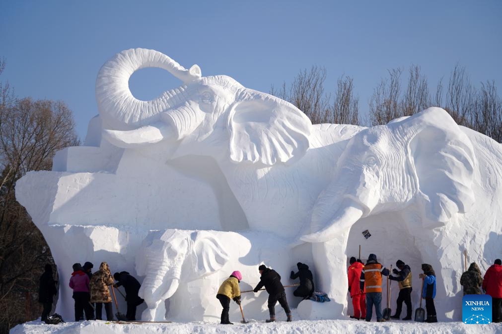 Sculptors work on a giant snow sculpture at the Sun Island scenic area in Harbin, northeast China's Heilongjiang Province, Dec. 19, 2023. Sculptors have been busy with snow sculpture works for the upcoming 36th Sun Island International Snow Sculpture Expo in Harbin.（Photo: Xinhua)