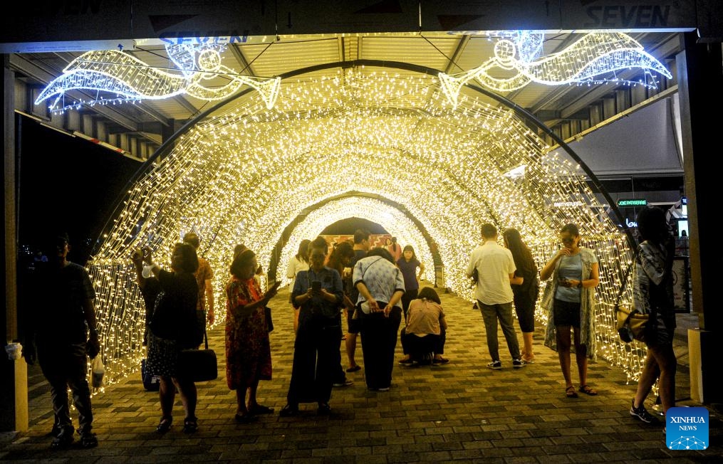 People visit Christmas Wonderland, a light show event, at Pakuwon City Mall in Surabaya, East Java, Indonesia, Dec. 18, 2023.（Photo: Xinhua)