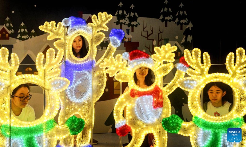 People visit Christmas Wonderland, a light show event, at Pakuwon City Mall in Surabaya, East Java, Indonesia, Dec. 18, 2023.（Photo: Xinhua)