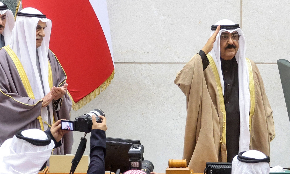 Kuwait's new emir Sheikh Mishal Al-Ahmad Al-Jaber Al-Sabah (right) salutes as he swears in before lawmakers as the country's 17th ruler, at the Kuwaiti parliament, on December 20, 2023 in Kuwait City. Photo: VCG