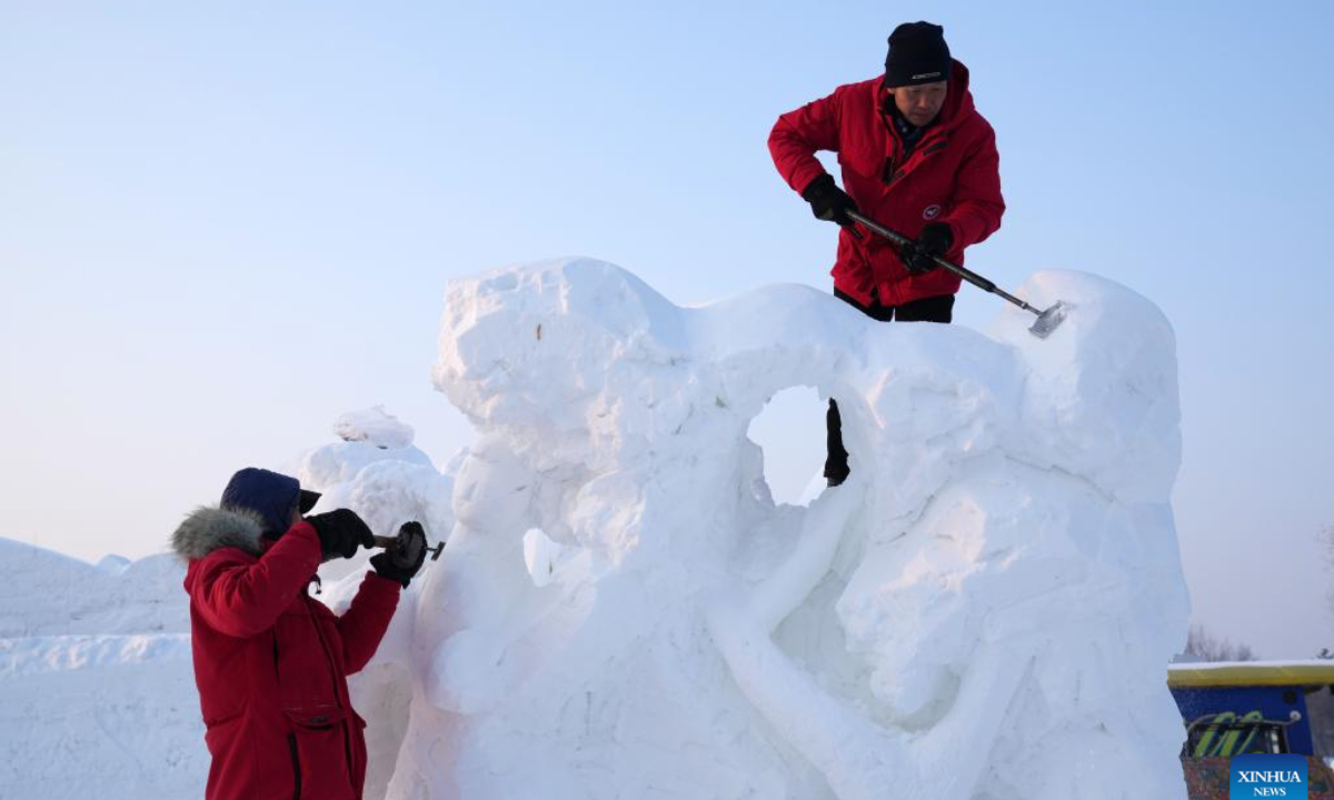 Contestants work on snow sculptures at the 30th National Snow Sculpture Contest in Harbin, northeast China's Heilongjiang Province, Dec 28, 2023. Photo:Xinhua