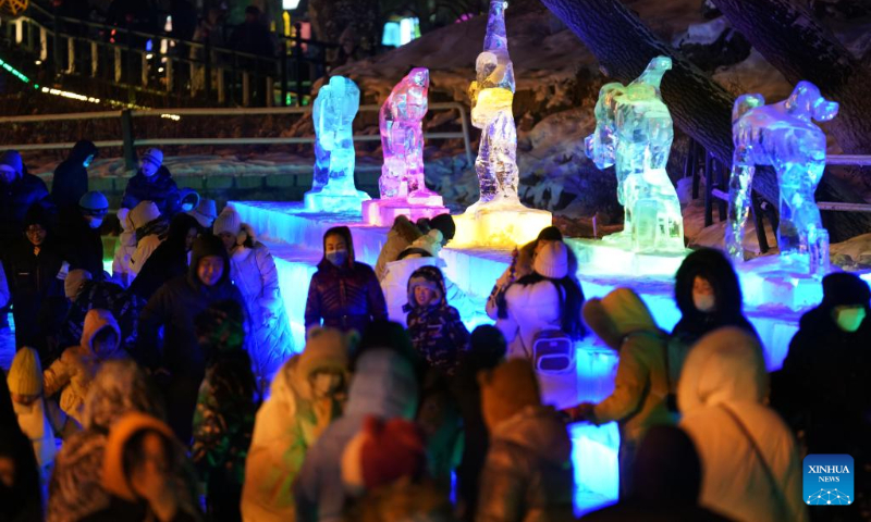 People visit the 50th Harbin ice lantern fair in Harbin, northeast China's Heilongjiang Province, Dec. 31, 2023. The ice lantern fair kicked off here on Sunday. (Xinhua/Wang Jianwei)