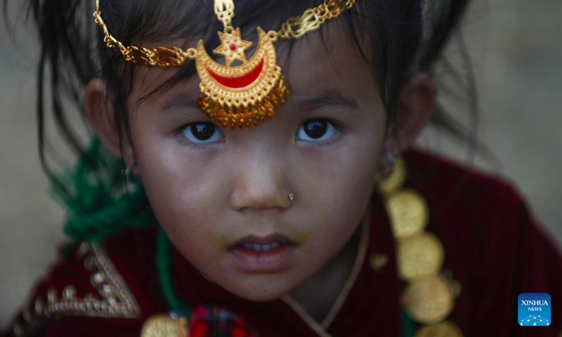 A girl in traditional attire from the Gurung community is pictured during the celebration of Tamu Lhosar festival to mark the commencement of Gurung new year in Kathmandu, Nepal, Dec. 31, 2023. (Photo by Sulav Shrestha/Xinhua)