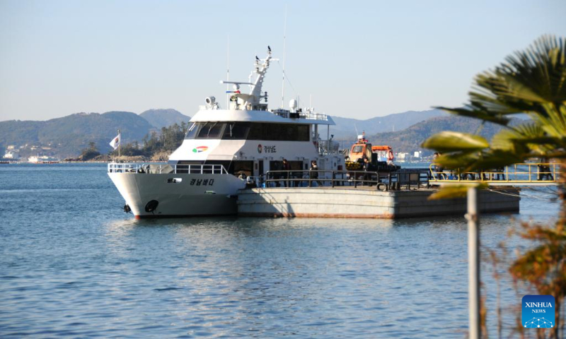 Tourists take cruise ship in Tongyeong, South Korea, Dec. 22, 2023. (Photo by Yang Chang/Xinhua)