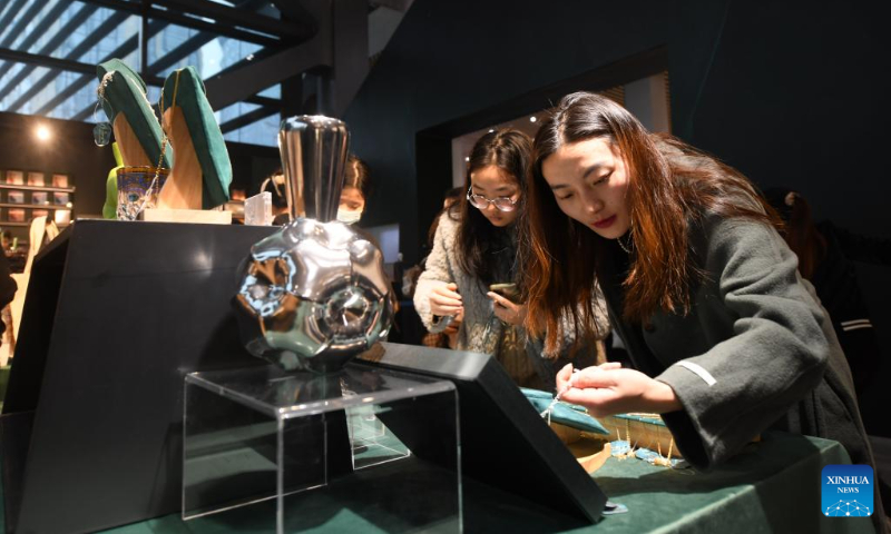 Tourists buy cultural and creative products at the Chengdu Museum in Chengdu, southwest China's Sichuan Province, Dec. 31, 2023. Cultural tourism has become an option for both residents and tourists in the southwestern city of Chengdu during the three-day New Year holiday. (Xinhua/Tang Wenhao)