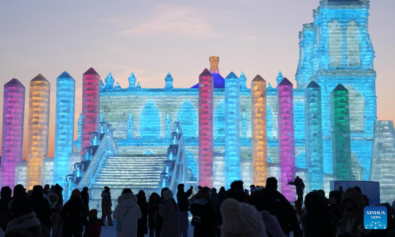 Tourists visit the Harbin Ice-Snow World in Harbin, northeast China's Heilongjiang Province, Dec. 31, 2023. Many tourists spent their last day of 2023 at Harbin Ice-Snow World, a renowned ice-and-snow theme park in northeast China's Heilongjiang Province. (Xinhua/Wang Jianwei)