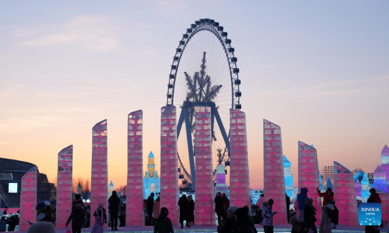 Tourists visit the Harbin Ice-Snow World in Harbin, northeast China's Heilongjiang Province, Dec. 31, 2023. Many tourists spent their last day of 2023 at Harbin Ice-Snow World, a renowned ice-and-snow theme park in northeast China's Heilongjiang Province. (Xinhua/Wang Jianwei)