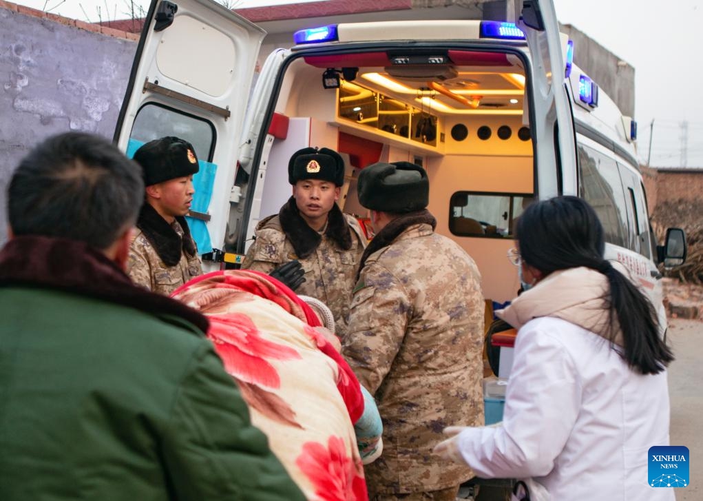 Soldiers transfer quake-affected mother and baby in Dahejia Township, Jishishan County, northwest China's Gansu Province, Dec. 19, 2023. The Chinese People's Liberation Army (PLA) and the People's Armed Police Force (PAPF) have deployed multiple rescue forces to quake-hit areas in response to a 6.2-magnitude earthquake that jolted northwest China's Gansu Province late Monday.(Photo: Xinhua)