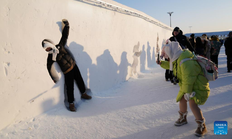 Tourists visit the Harbin Ice-Snow World in Harbin, northeast China's Heilongjiang Province, Dec. 31, 2023. Many tourists spent their last day of 2023 at Harbin Ice-Snow World, a renowned ice-and-snow theme park in northeast China's Heilongjiang Province. (Xinhua/Wang Jianwei)