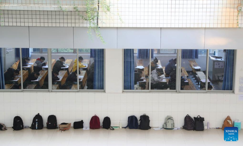 Examinees attend the postgraduate admission exam at an examination site in the University of South China, in Hengyang, central China's Hunan Province, Dec. 23, 2023. (Photo by Cao Zhengping/Xinhua)