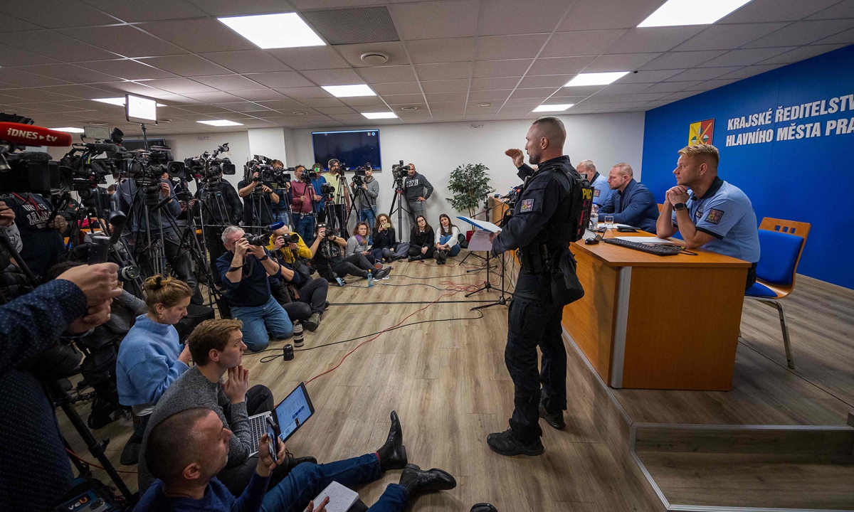 Journalists listen during a press conference by the police on December 22, 2023 in Prague on a deadly mass shooting at a university the day before. The gunman who opened fire at Prague's Charles University killed 13 people and then himself, Czech authorities said. Czech police are probing into the gunman's motive as the government declared a national day of mourning. Photo: VCG