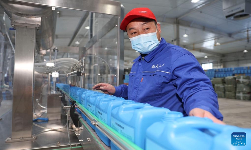 A man works at a biotech company of the Xinjiang Production and Construction Corps in northwest China's Xinjiang Uygur Autonomous Region, Dec. 21, 2023. (Xinhua/Hu Huhu)