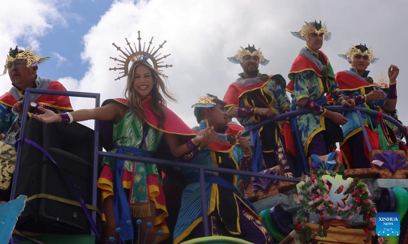 Revelers enjoy their time during the Carnival of Blacks and Whites in Pasto, Colombia on Jan. 6, 2024. The carnival was inscribed on the UNESCO Representative List of the Intangible Cultural Heritage of Humanity in 2009. (Xinhua/Zhou Shengping)