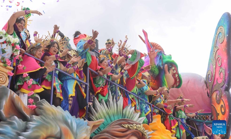 Revelers enjoy their time during the Carnival of Blacks and Whites in Pasto, Colombia on Jan. 6, 2024. The carnival was inscribed on the UNESCO Representative List of the Intangible Cultural Heritage of Humanity in 2009. (Xinhua/Zhou Shengping)