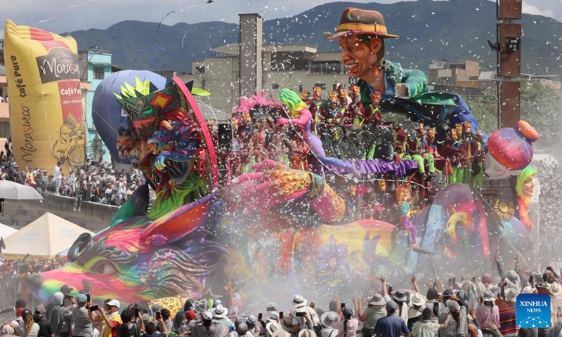 Revelers enjoy their time during the Carnival of Blacks and Whites in Pasto, Colombia on Jan. 6, 2024. The carnival was inscribed on the UNESCO Representative List of the Intangible Cultural Heritage of Humanity in 2009. (Xinhua/Zhou Shengping)