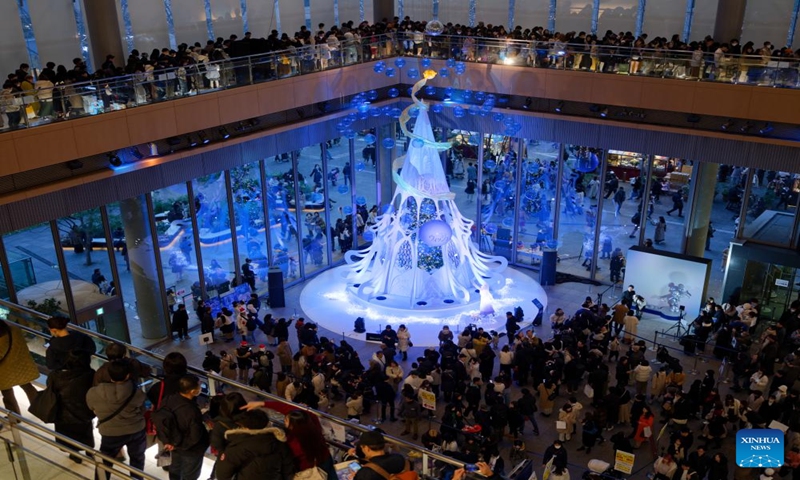 People visit a special Christmas tree in a mall near the Tokyo Station in Tokyo, Japan, Dec. 24, 2023. (Xinhua/Zhang Xiaoyu)