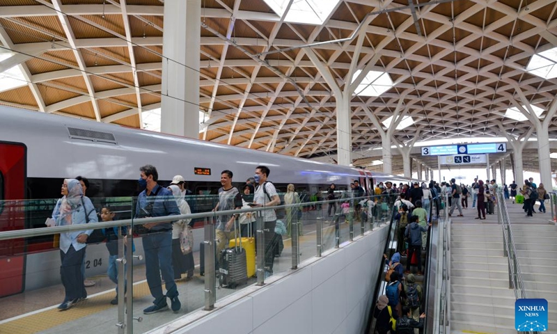 Passengers walk on the platform of Halim Station in Jakarta, Indonesia, Dec. 25, 2023. The Jakarta-Bandung High-Speed Railway (HSR), the first HSR in Indonesia and Southeast Asia, has handled more than 1 million passenger trips since its commercial operation was officially launched on Oct. 17, according to the China State Railway Group Co. Ltd. on Monday. The railway's passenger trips hit the 1-million mark in number on Sunday(Photo: Xinhua)