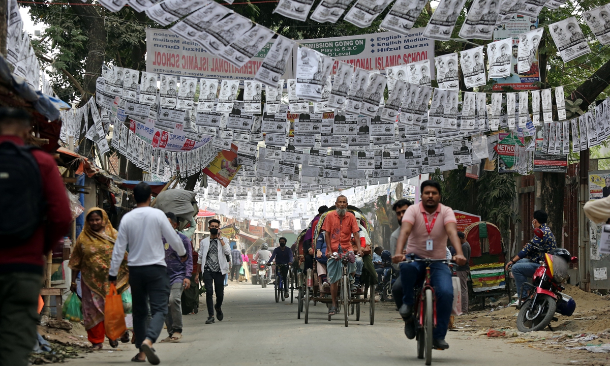 Posters of election candidates are hanging over a street in Dhaka, Bangladesh, on December 27, 2023. Bangladesh Chief Election Commissioner Kazi Habibul Awal has announced the schedule for the upcoming general election which will take place on January 7, 2024. Photo: VCG