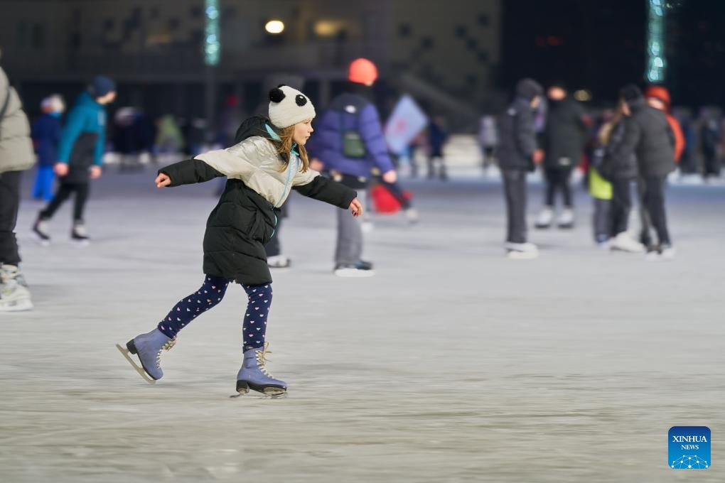 A visitor skates at the Pioneer ice rink in Vladivostok, Russia, Dec. 25, 2023. Pioneer, the largest ice rink in Russia's Far East city of Vladivostok, opened to the public on Monday.(Photo: Xinhua)