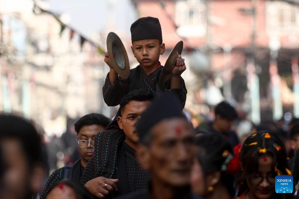 A boy in traditional attire joins a rally to celebrate Yomari Punhi in Kathmandu, Nepal, Dec. 26, 2023. Yomari Punhi is a festival especially celebrated by Newar community in Nepal to mark the end of the rice harvest on full moon day.(Photo: Xinhua)