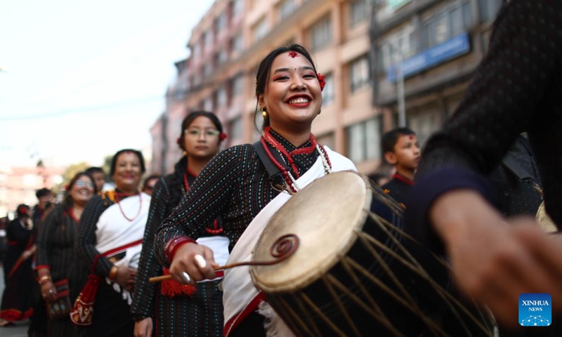 A girl in traditional attire joins a rally to celebrate Yomari Punhi in Kathmandu, Nepal, Dec. 26, 2023. Yomari Punhi is a festival especially celebrated by Newar community in Nepal to mark the end of the rice harvest on full moon day.(Photo: Xinhua)