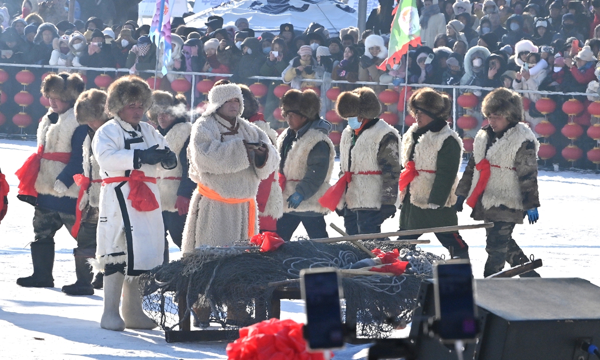 Participants wearing thick cotton-padded jackets and leather boots perform at the opening ceremony of ice fishing tourist festival at Chagan Lake, one of China's largest freshwater lakes, in Songyuan, Northeast China's Jilin Province on December 28, 2023. Photo: IC