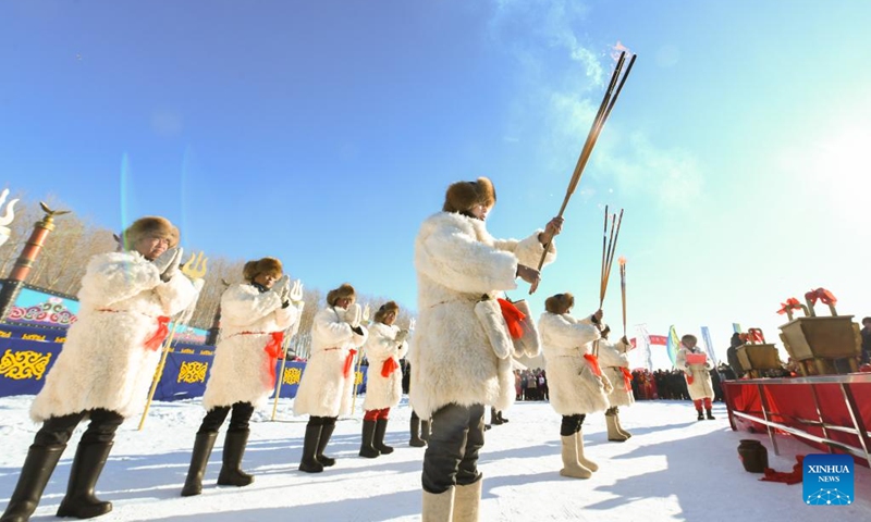 People perform during a winter fishing event on the frozen Lianhuan Lake in Mongolian Autonomous County of Dorbod, Daqing City, northeast China's Heilongjiang Province, Dec. 27, 2023. The winter fishing event in Heilongjiang Province, featuring more than 25 fishing events across 18 county-level locations, will extend until the end of March of the next year.(Photo: Xinhua)