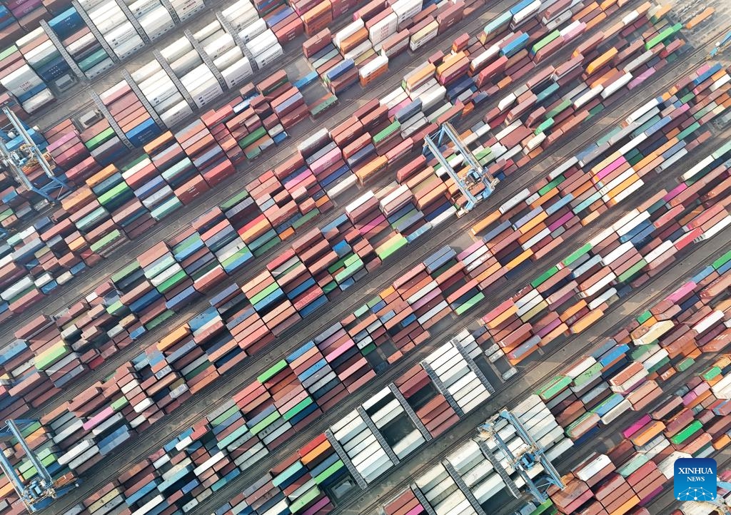 This aerial photo taken on Dec. 27, 2023 shows the container yard at Qingdao Port, east China's Shandong Province. Qingdao Port's automated terminal phase III project was put into operation on Wednesday, with two 100,000-metric-ton container berths(Photo: Xinhua)